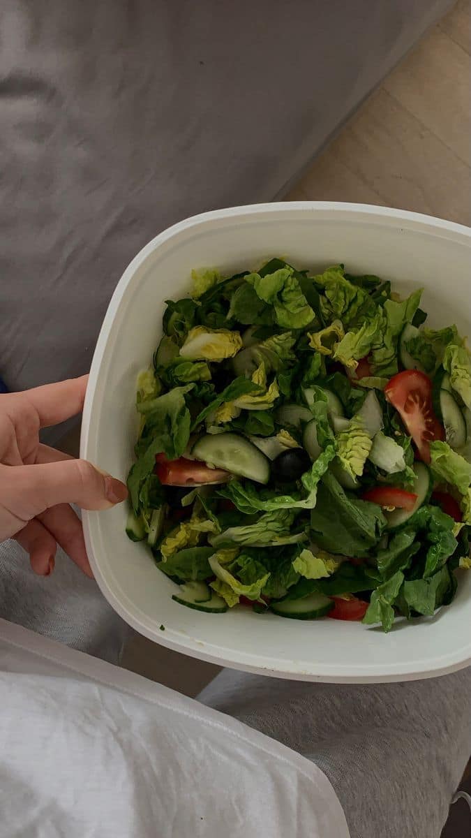 Bowls of grilled protein with rice, avocado, and vegetables, representing a balanced meal plan