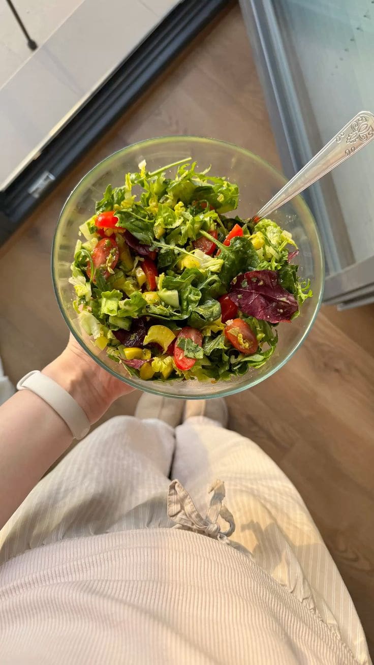 Colorful bowl of fresh vegetables and whole foods representing a balanced diet